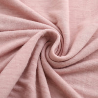 Túnica femenina de encaje elástico, suave y ceñida, con textura de lavado.