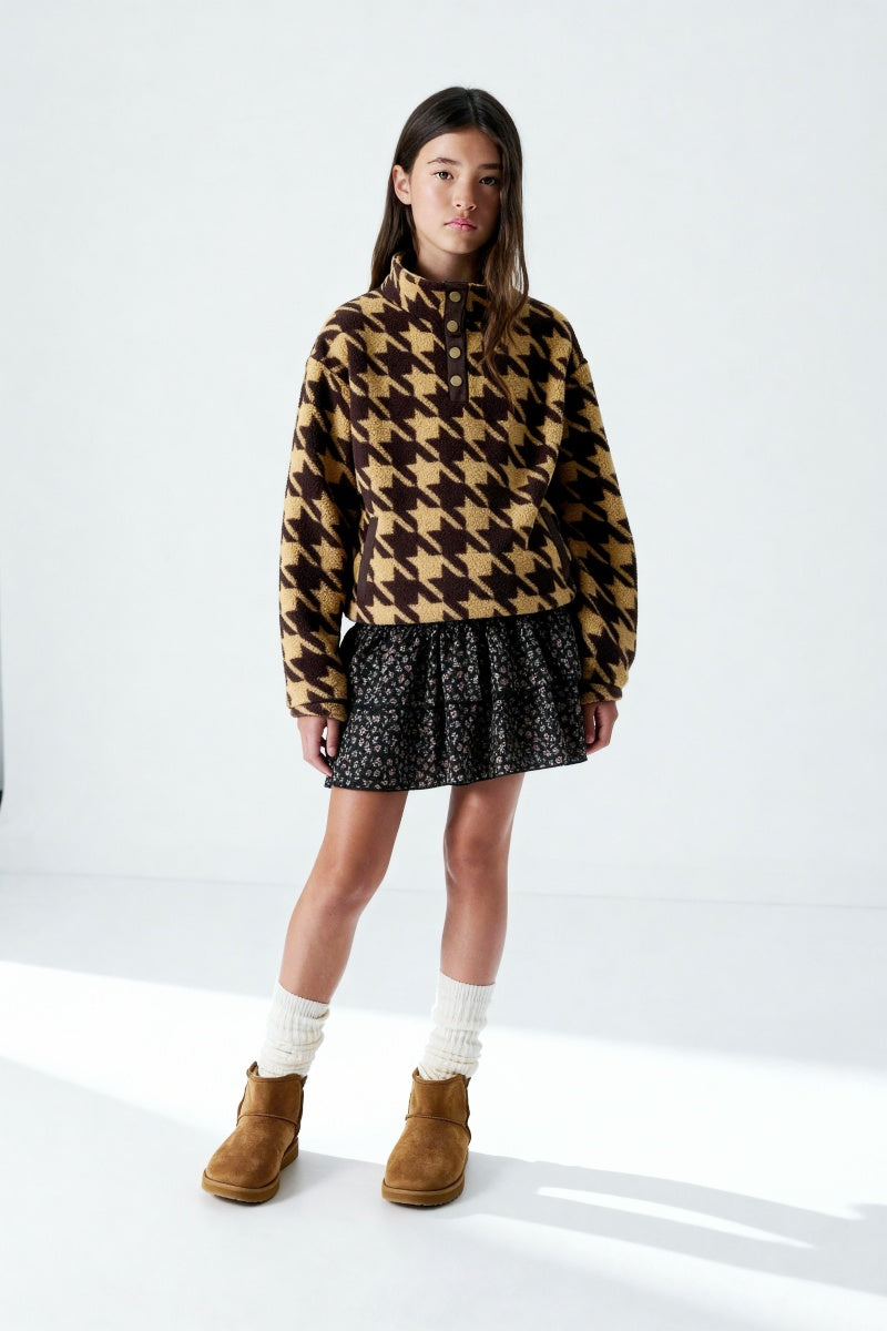 Comfortable daytime style, featuring a quarter-button design and fleece fabric, available in both boys' and girls' sizes